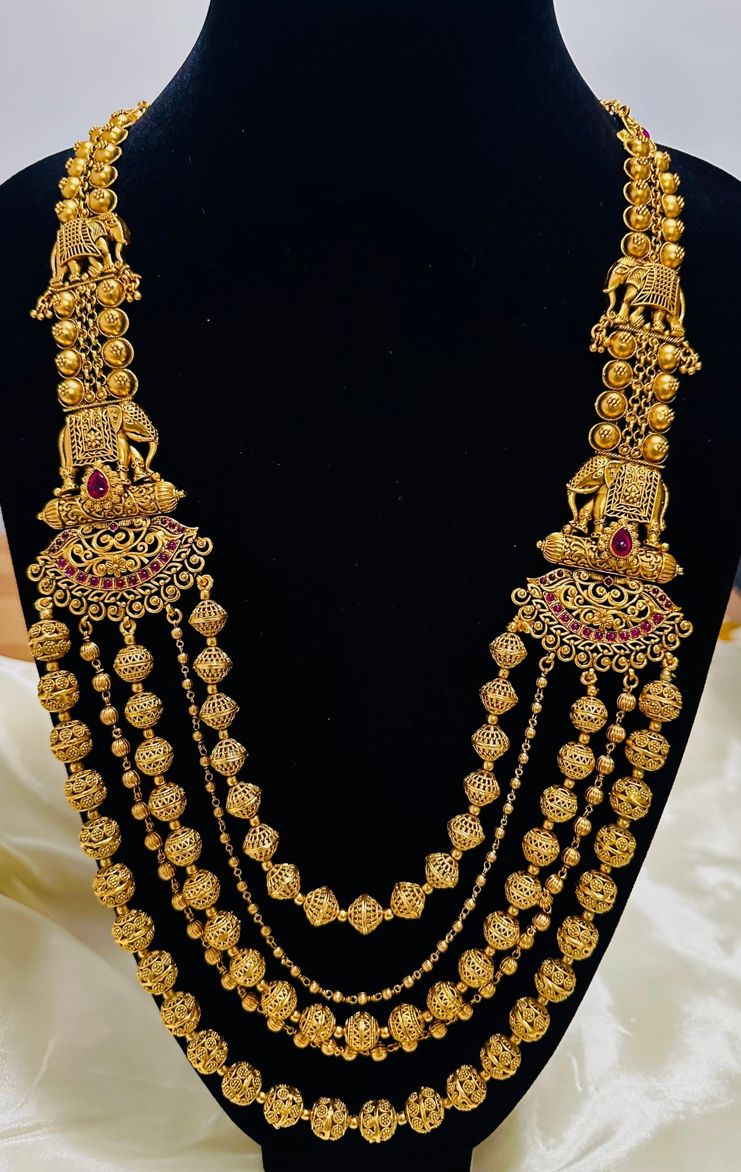 Grand Elephant Motifs: Antique Gold-Toned Multi-Strand Beaded Necklace and Jhumka Earring Set