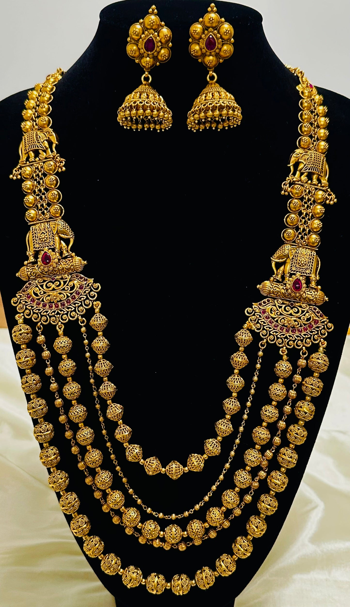 Grand Elephant Motifs: Antique Gold-Toned Multi-Strand Beaded Necklace and Jhumka Earring Set