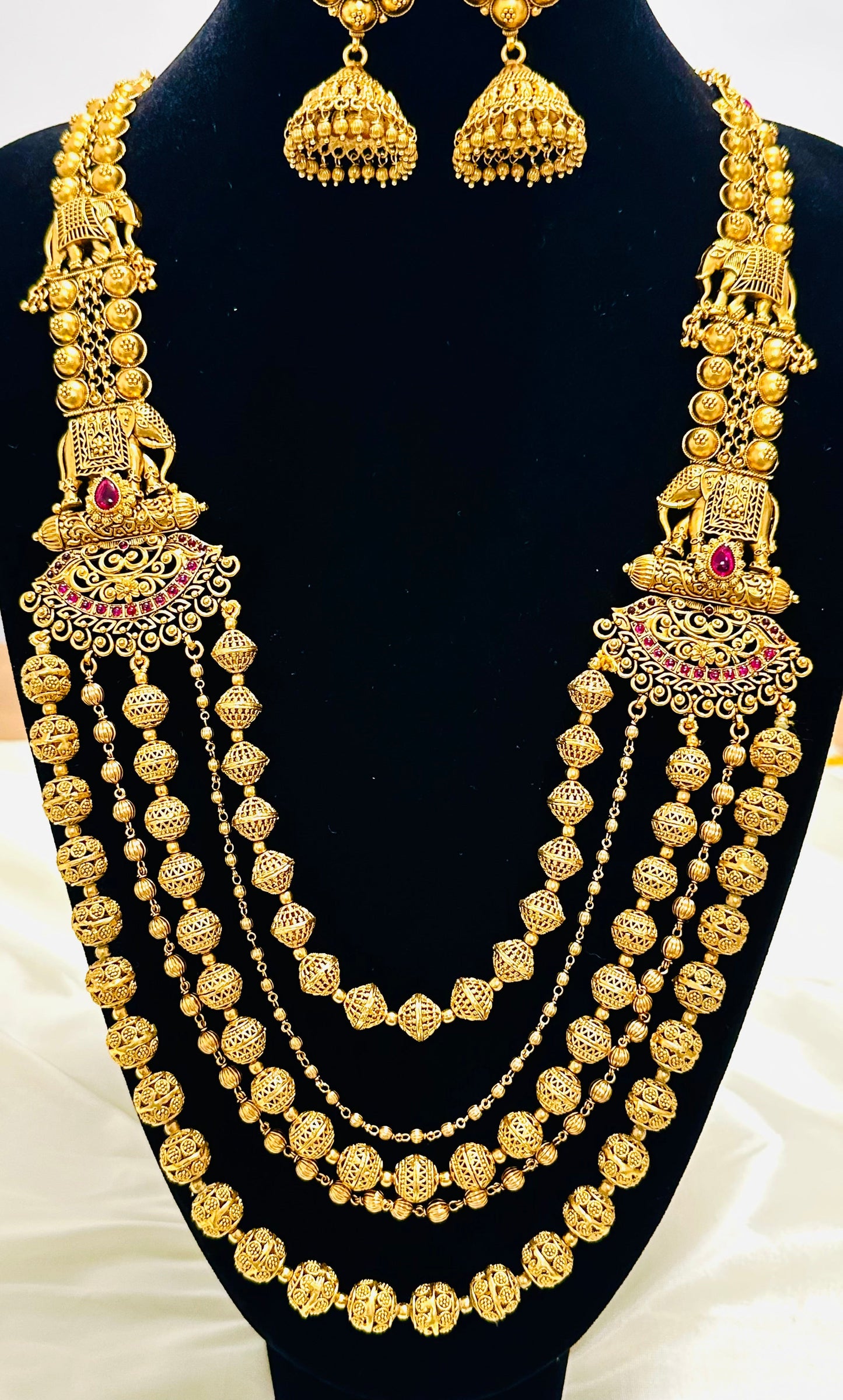 Grand Elephant Motifs: Antique Gold-Toned Multi-Strand Beaded Necklace and Jhumka Earring Set