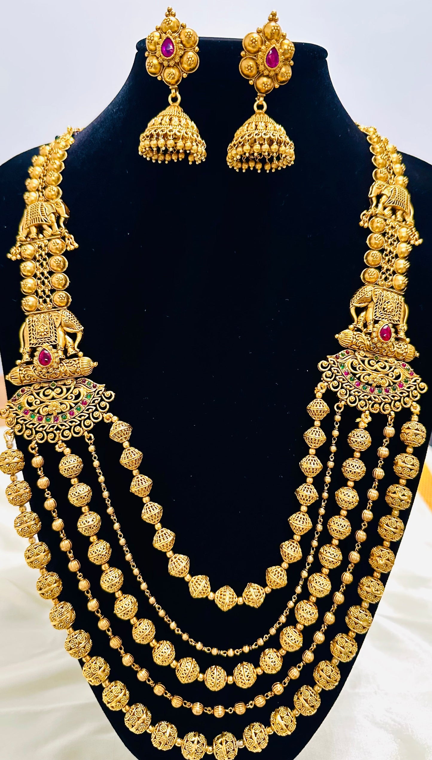 Grand Elephant Motifs: Antique Gold-Toned Multi-Strand Beaded Necklace and Jhumka Earring Set