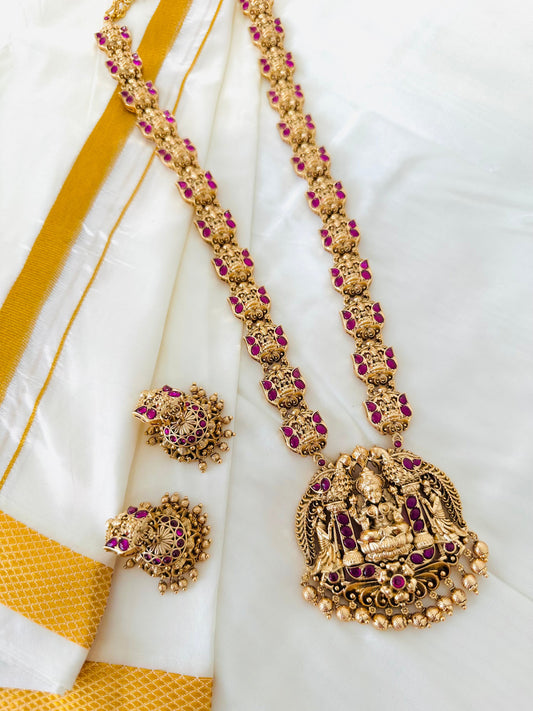 Grand Antique Gold-Toned Lakshmi Haram Necklace and Stud Earring Set with Ruby Accents