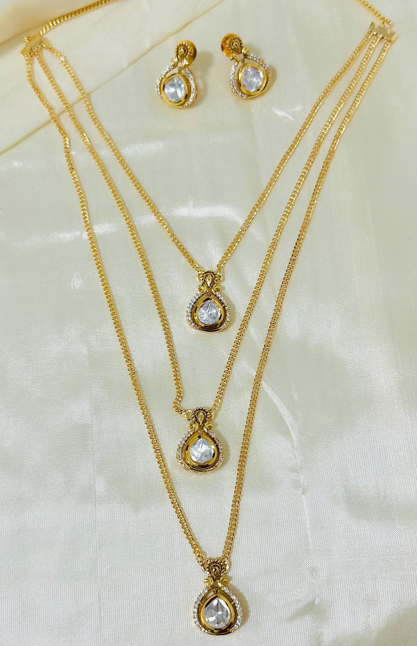 Exquisite Gold-Toned Multi-Layered Necklace & Earring Set with Sparkling Teardrop Pendants