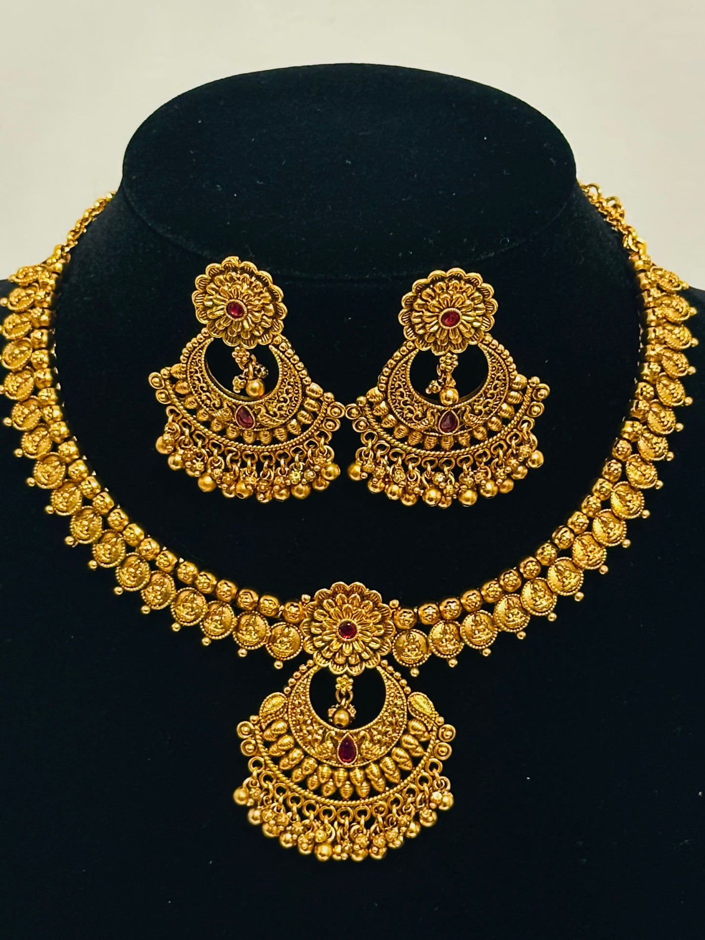Exquisite Antique Gold-Toned Choker Necklace and Jhumka Earring Set with Floral and Crescent Motifs