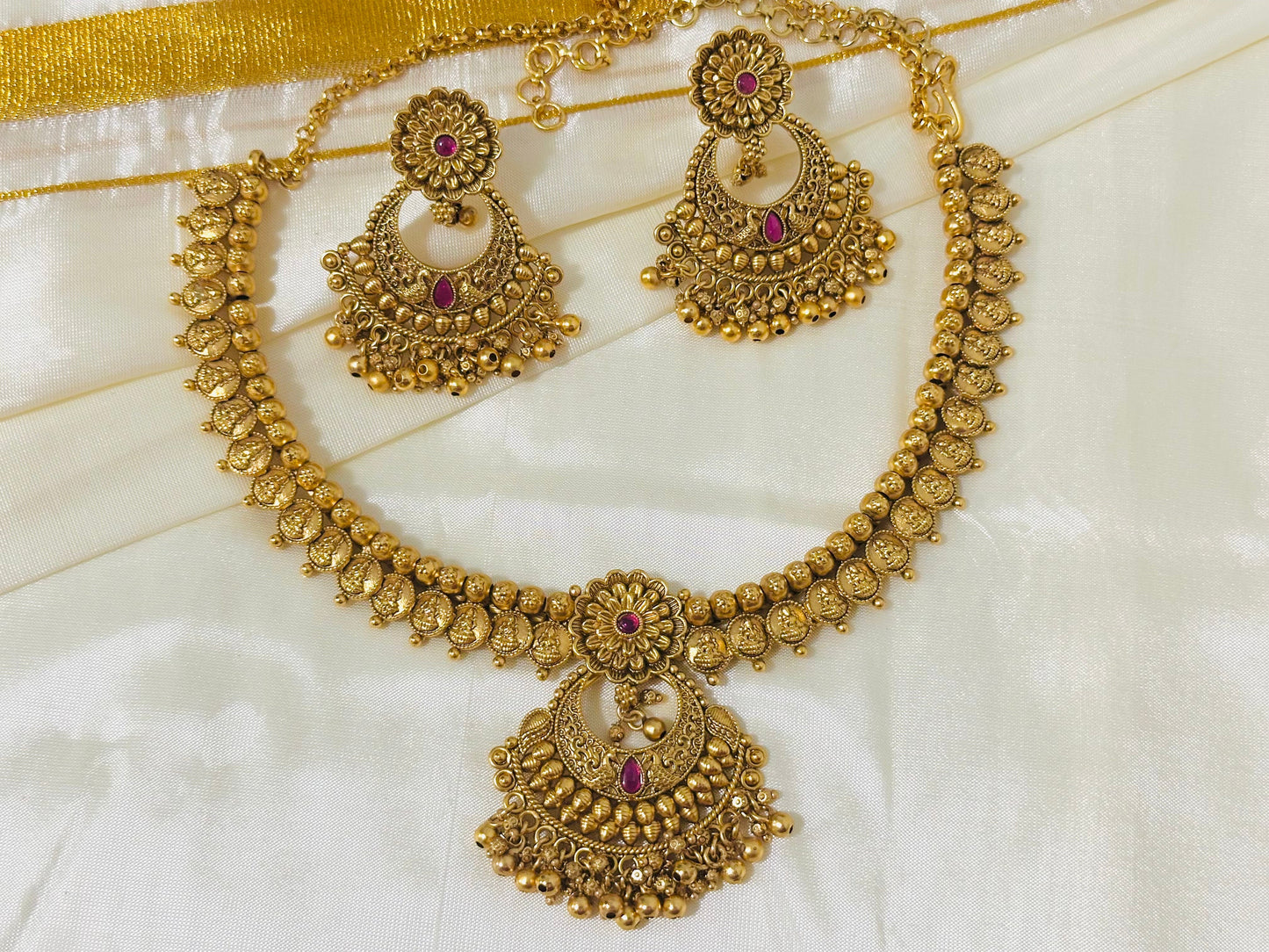 Exquisite Antique Gold-Toned Choker Necklace and Jhumka Earring Set with Floral and Crescent Motifs