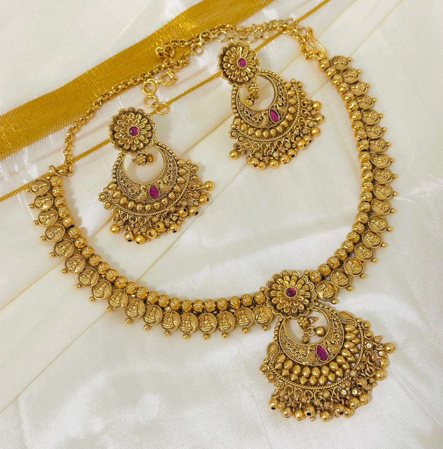 Exquisite Antique Gold-Toned Choker Necklace and Jhumka Earring Set with Floral and Crescent Motifs