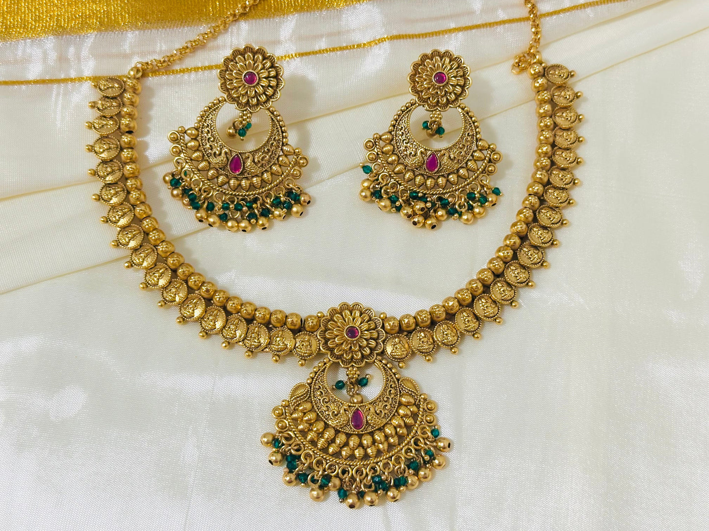 Exquisite Antique Gold-Toned Choker Necklace and Jhumka Earring Set with Floral and Crescent Motifs