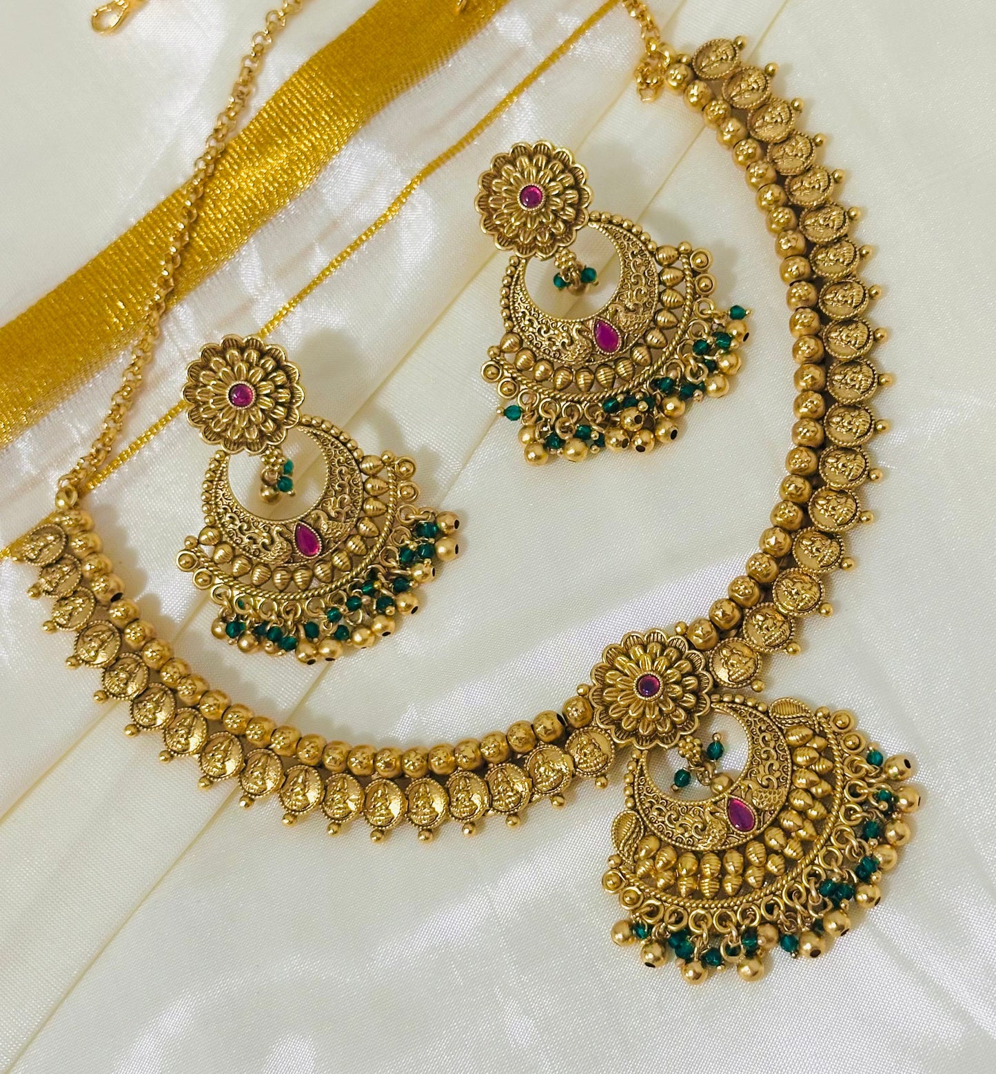 Exquisite Antique Gold-Toned Choker Necklace and Jhumka Earring Set with Floral and Crescent Motifs