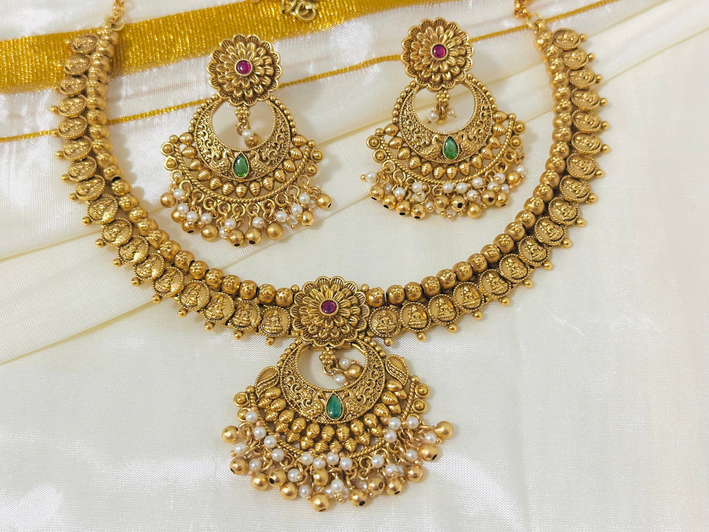 Exquisite Antique Gold-Toned Choker Necklace and Jhumka Earring Set with Floral and Crescent Motifs