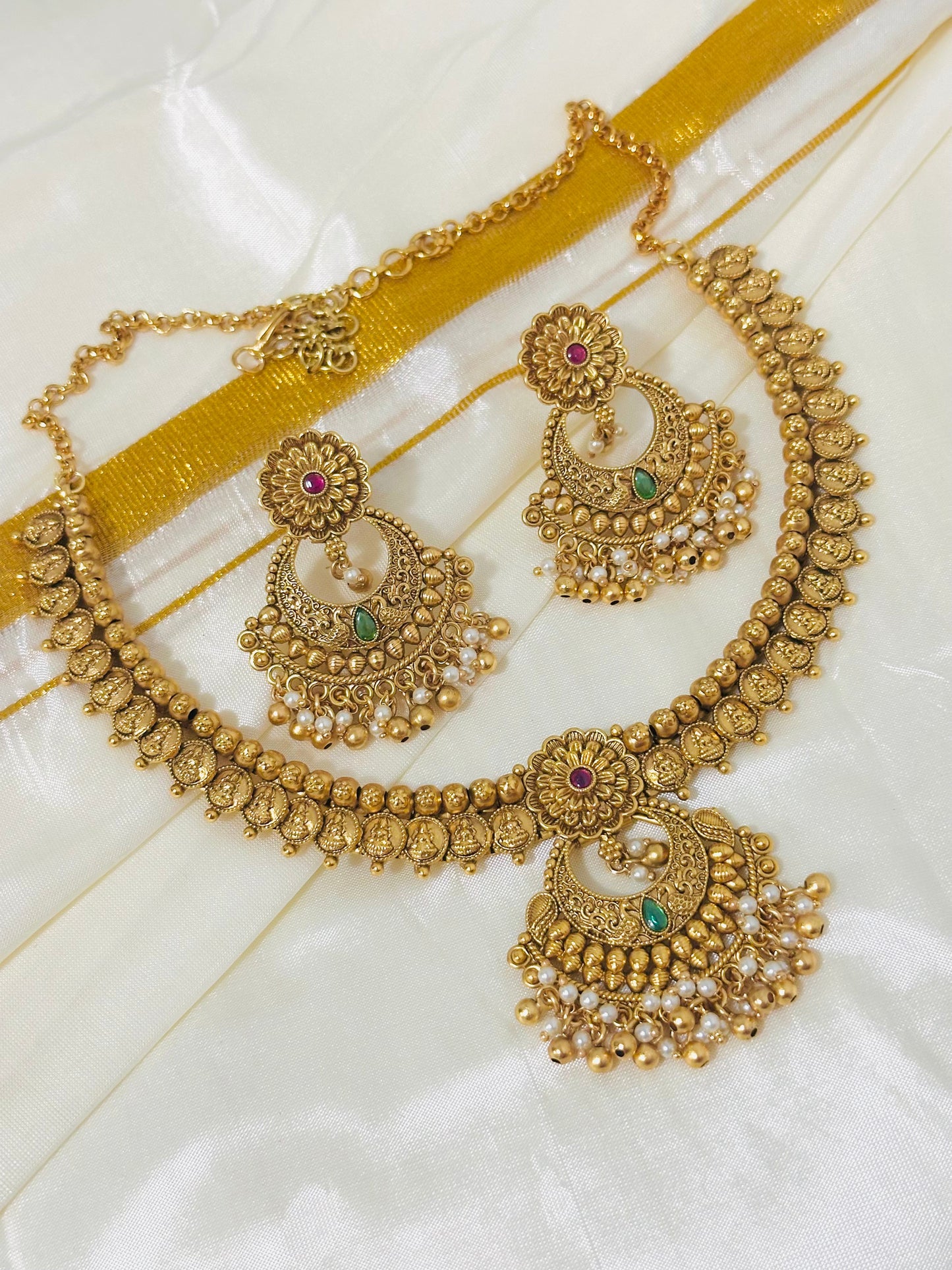 Exquisite Antique Gold-Toned Choker Necklace and Jhumka Earring Set with Floral and Crescent Motifs