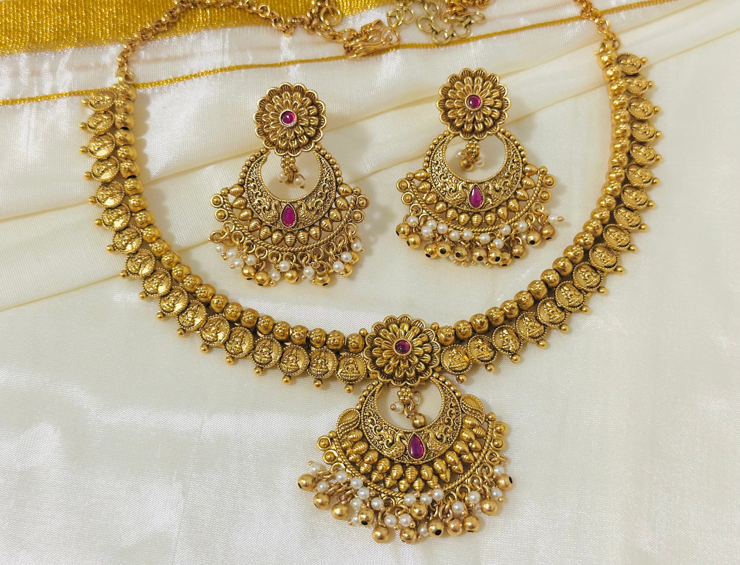 Exquisite Antique Gold-Toned Choker Necklace and Jhumka Earring Set with Floral and Crescent Motifs