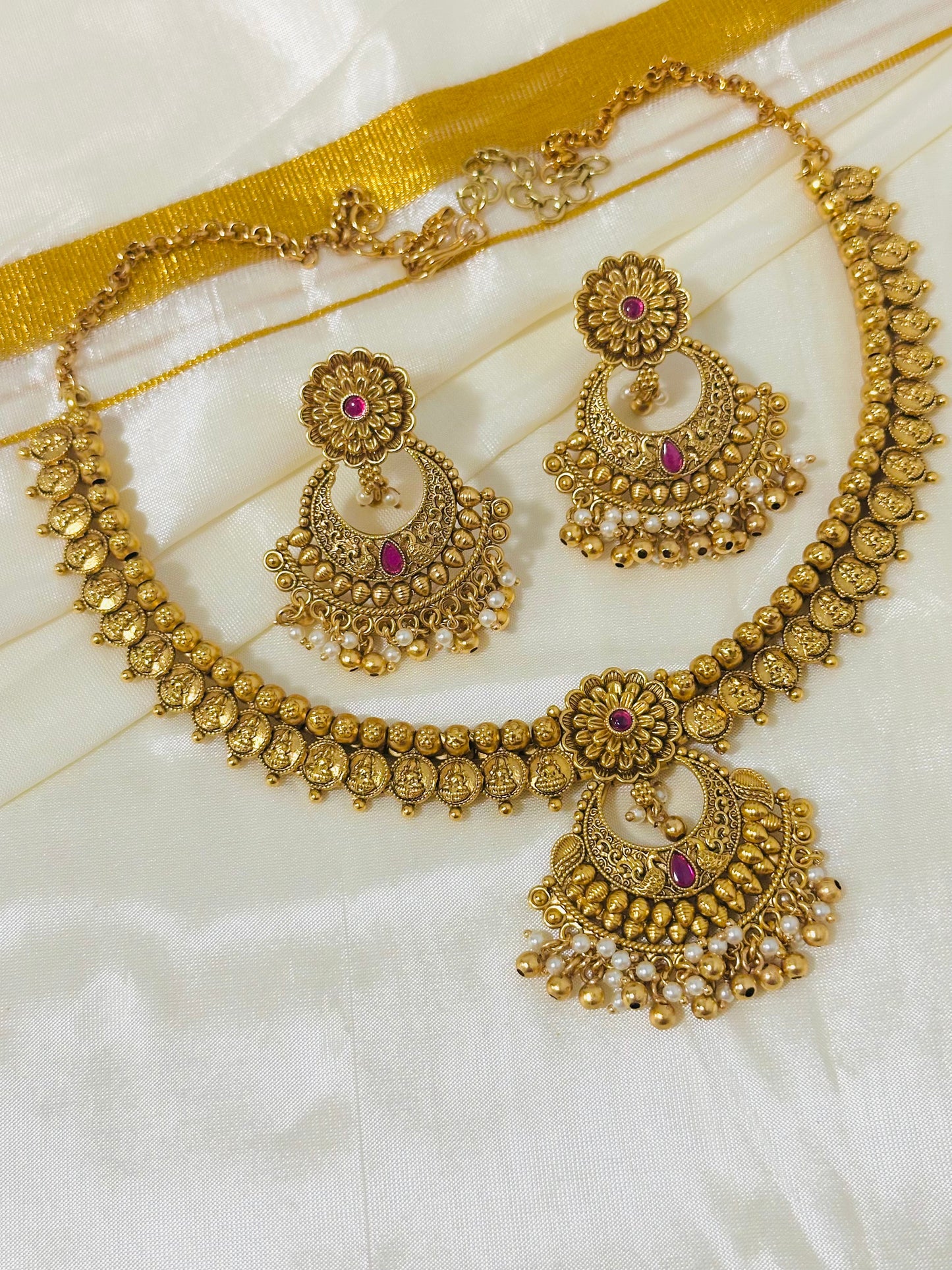 Exquisite Antique Gold-Toned Choker Necklace and Jhumka Earring Set with Floral and Crescent Motifs