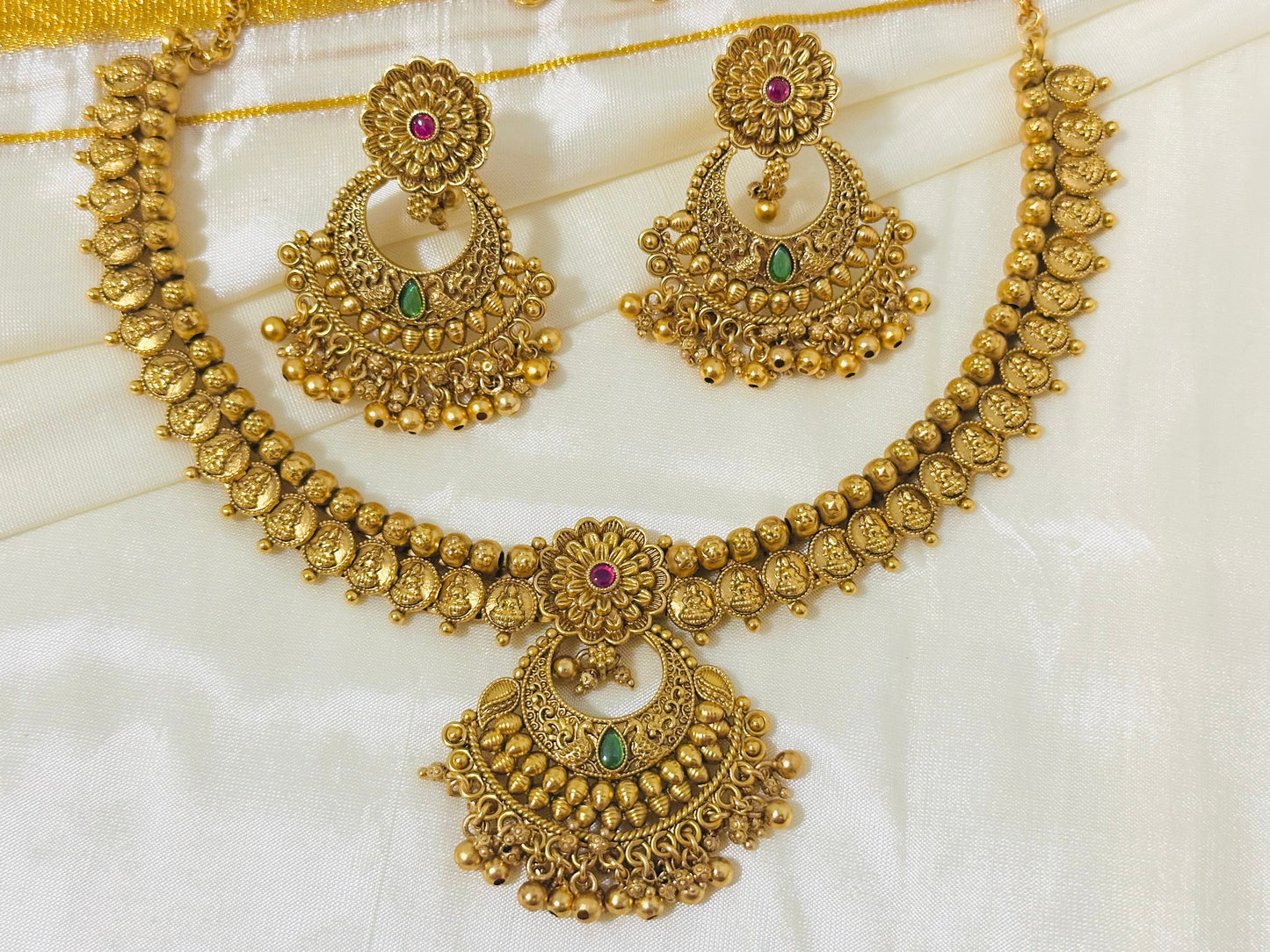 Exquisite Antique Gold-Toned Choker Necklace and Jhumka Earring Set with Floral and Crescent Motifs