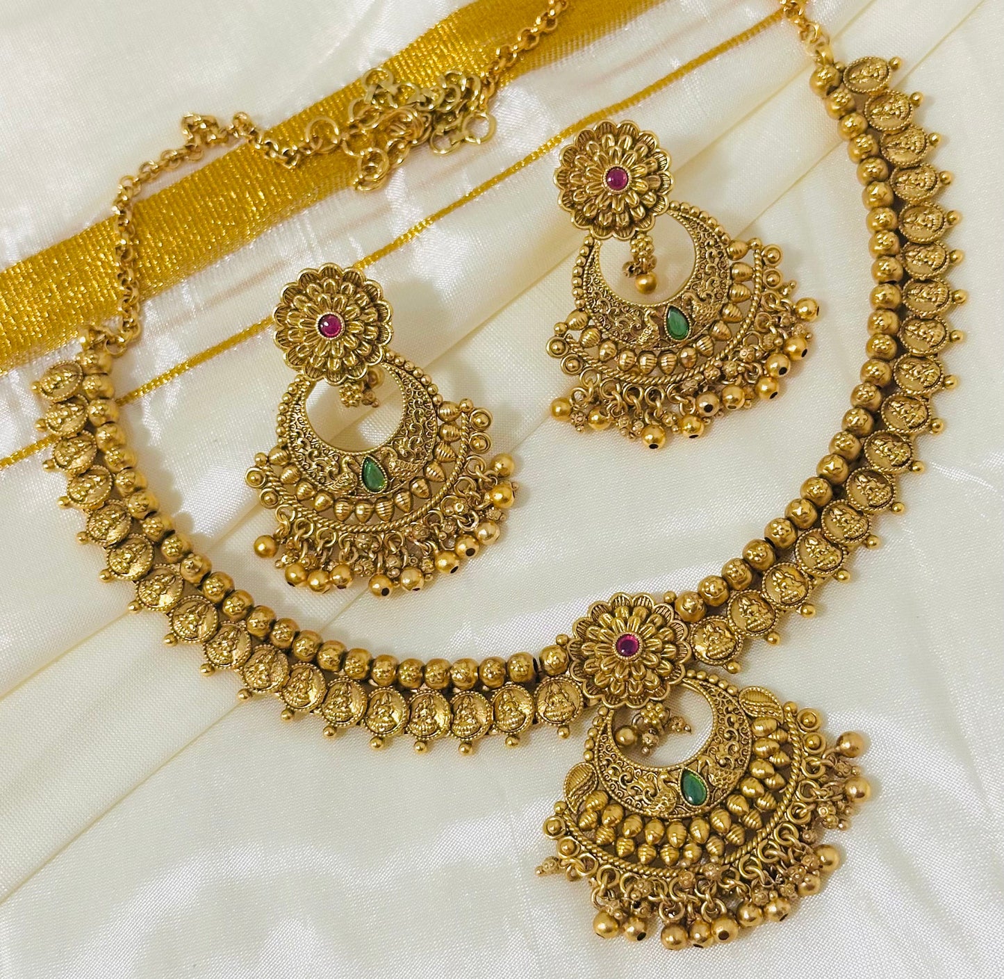 Exquisite Antique Gold-Toned Choker Necklace and Jhumka Earring Set with Floral and Crescent Motifs