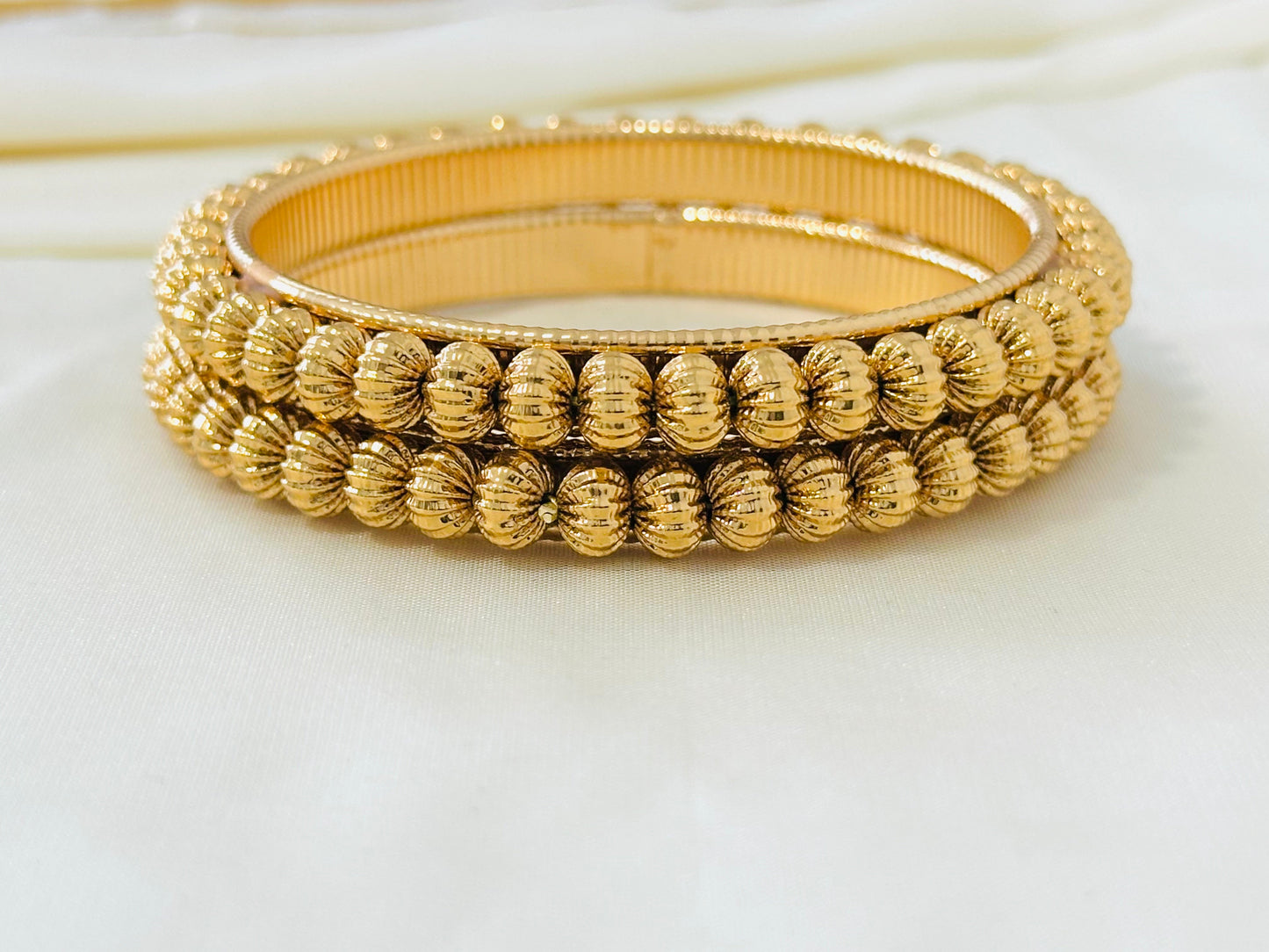 Elegant Gold-Toned Textured Bangles (Set of 2)