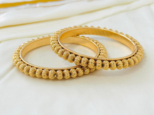 Elegant Gold-Toned Textured Bangles (Set of 2)