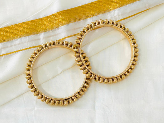 Elegant Gold-Toned Textured Bangles (Set of 2)