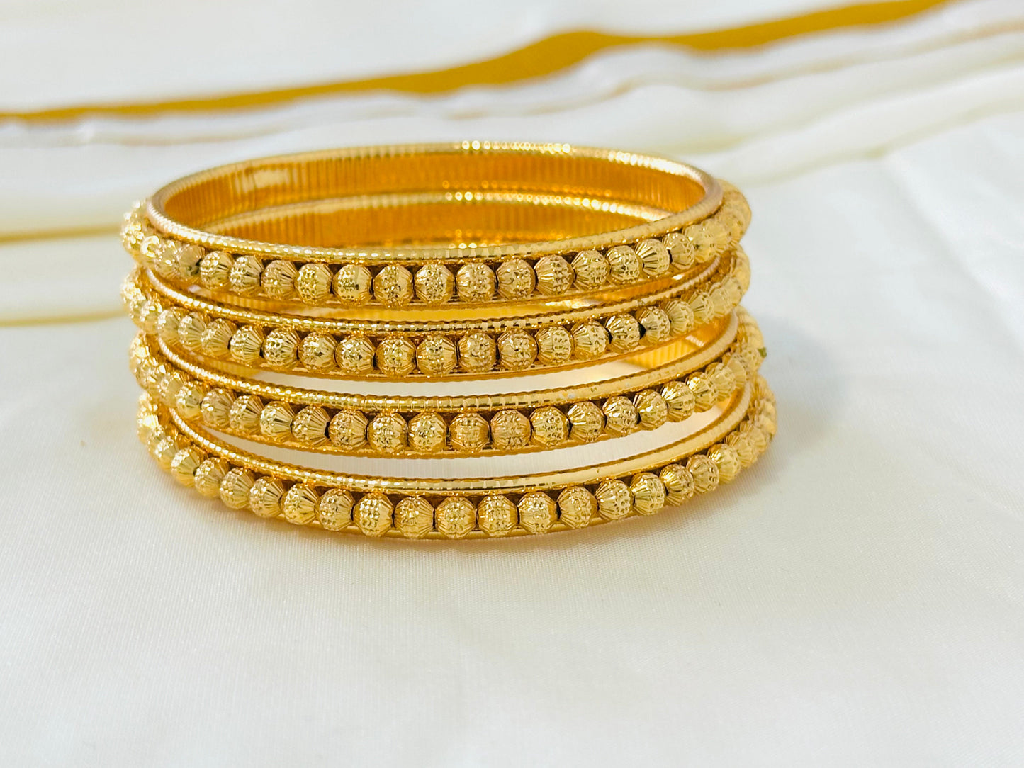 Elegant Gold-Toned Delicate Bangles (Set of 4)