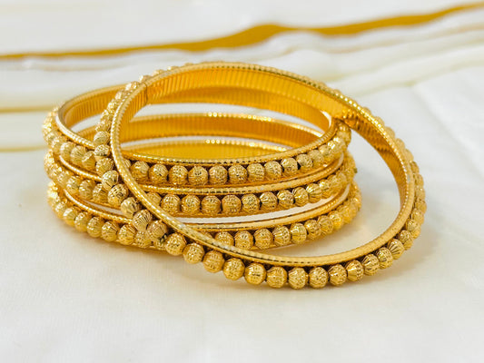 Elegant Gold-Toned Delicate Bangles (Set of 4)