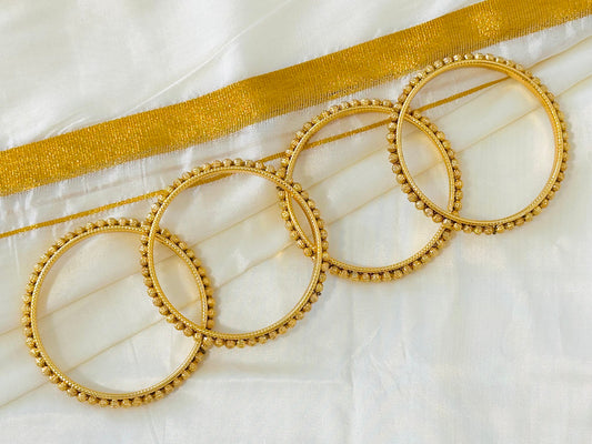 Elegant Gold-Toned Delicate Bangles (Set of 4)