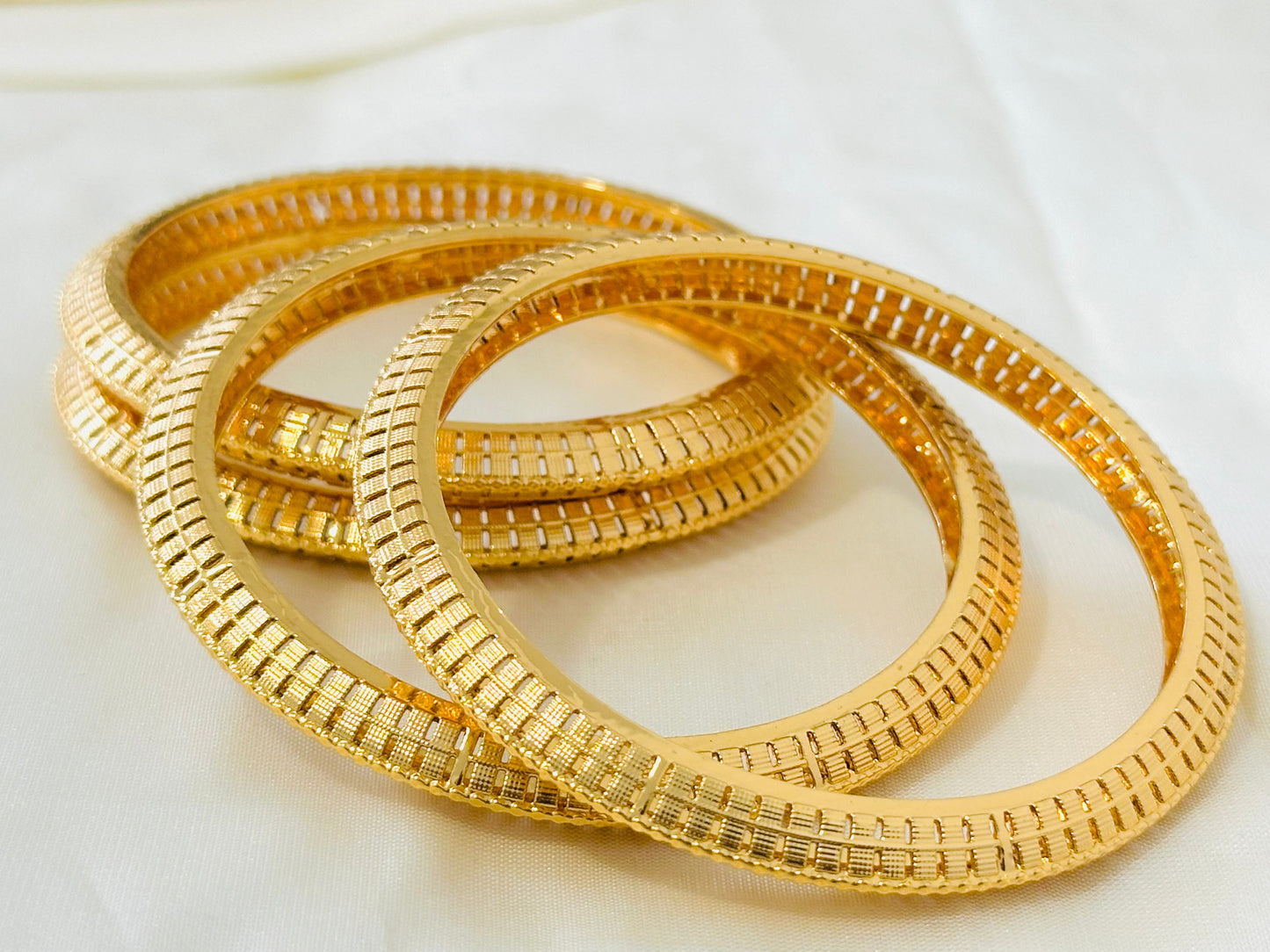 Antique Gold-Toned Cut-Out Pattern Bangles (Set of 4)