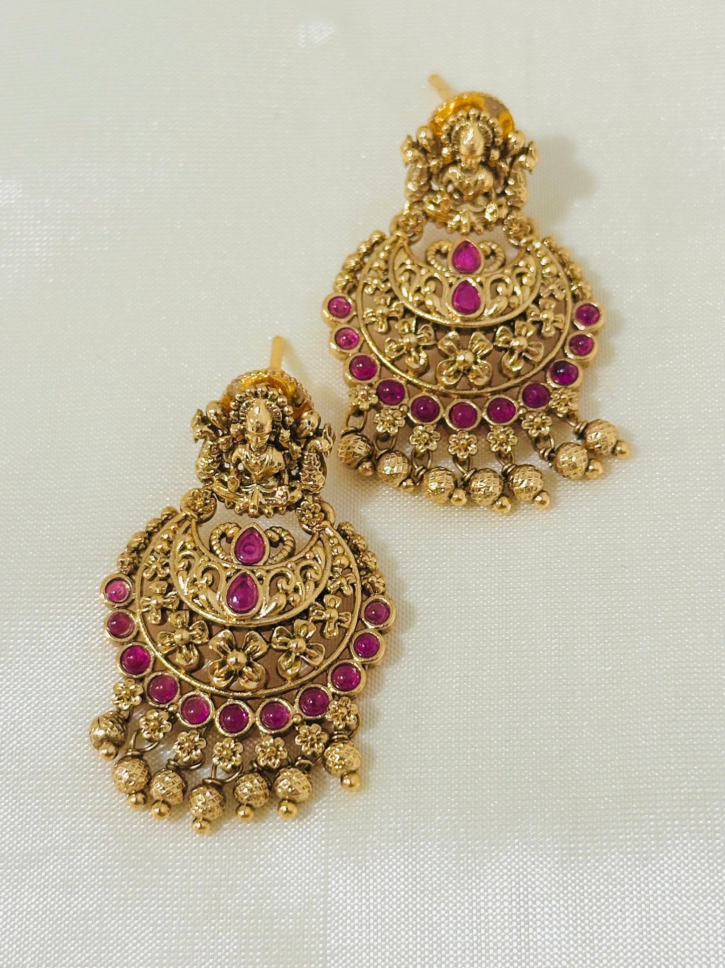 Magnificent Traditional Gold-Toned Lakshmi Temple Chandbali Earrings with Ruby Accents