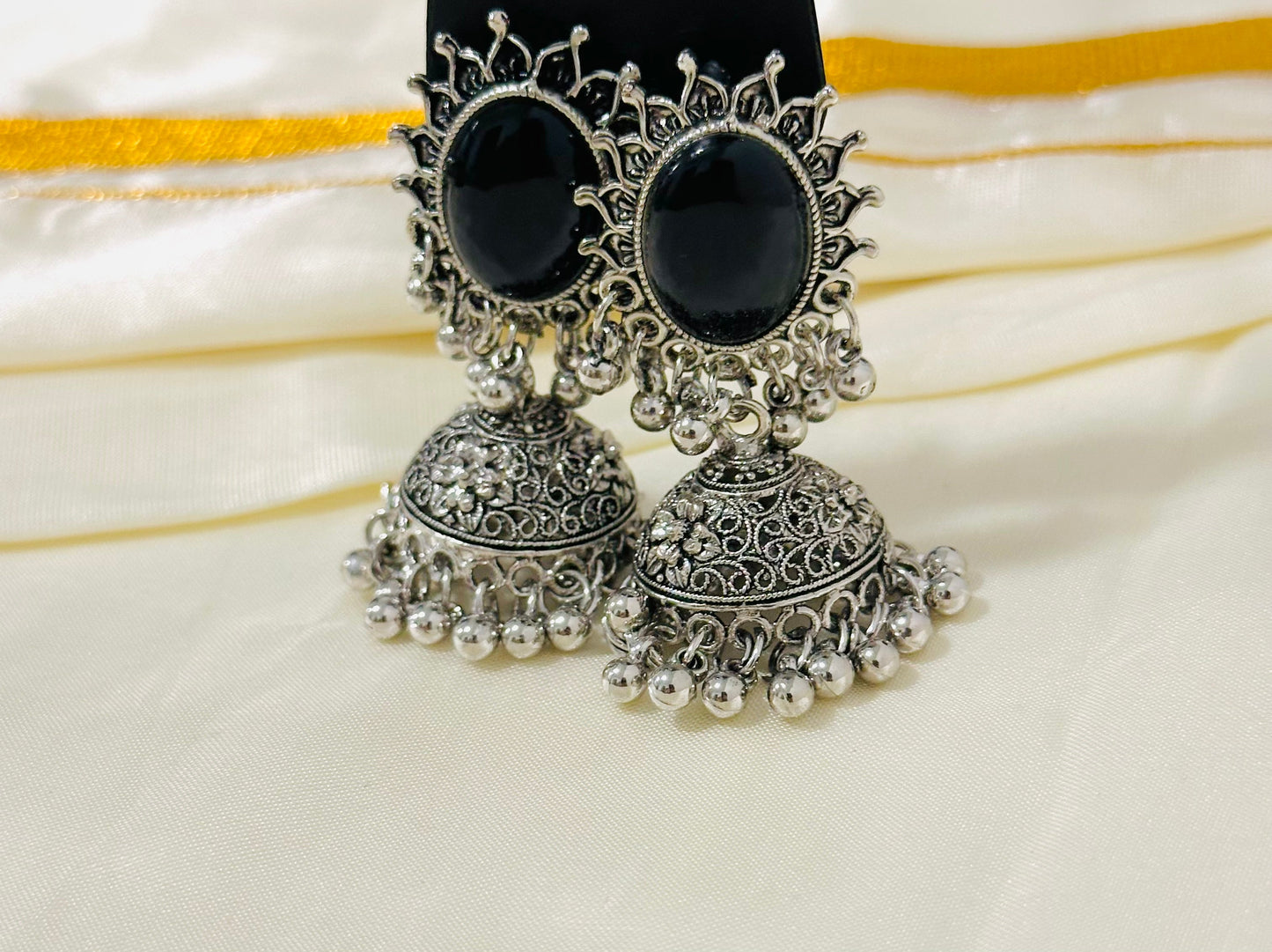 Grand Oxidized Silver Jhumka Earrings with Bold Black Stone