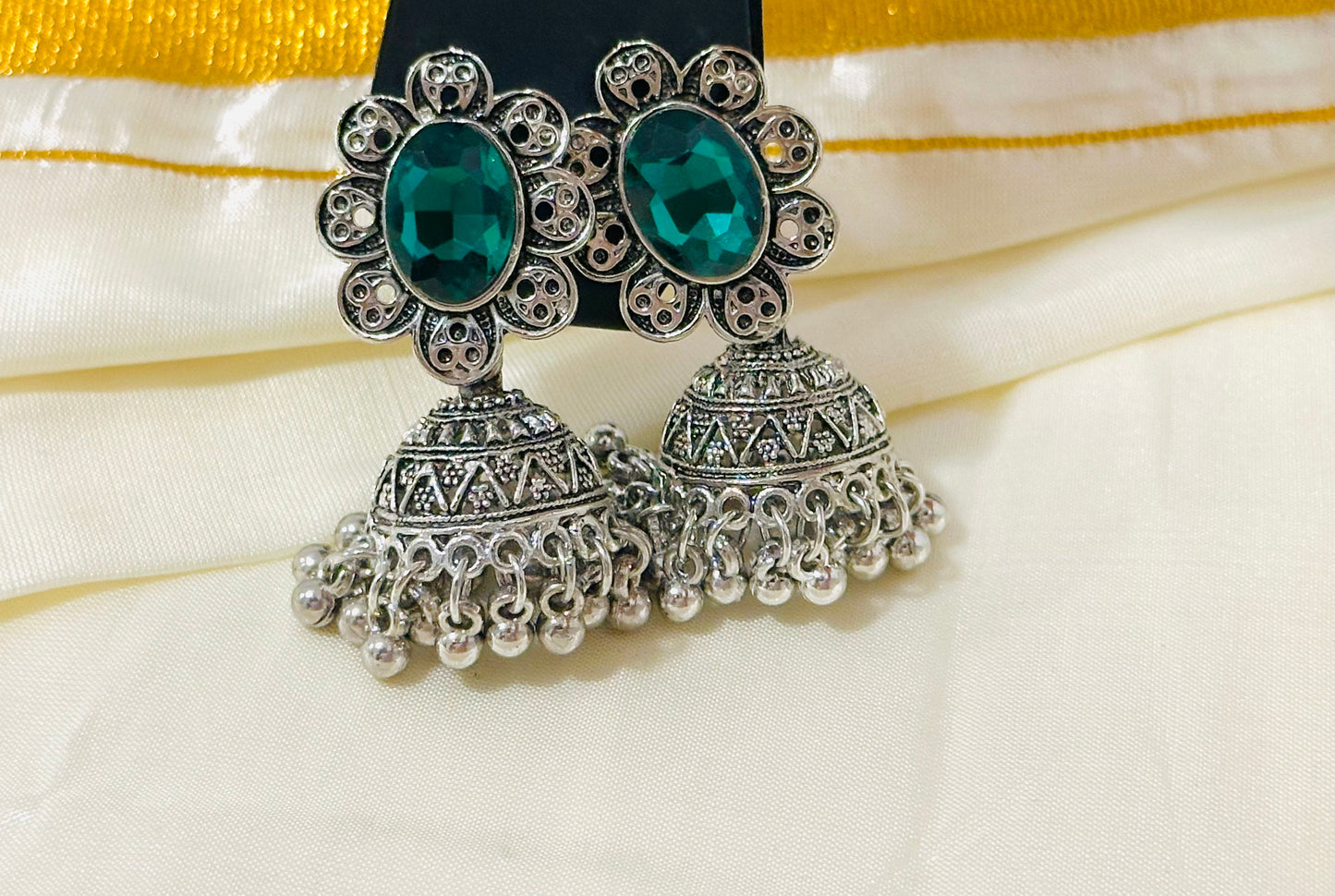 Enchanting Oxidized Silver Jhumka Earrings with color Stone