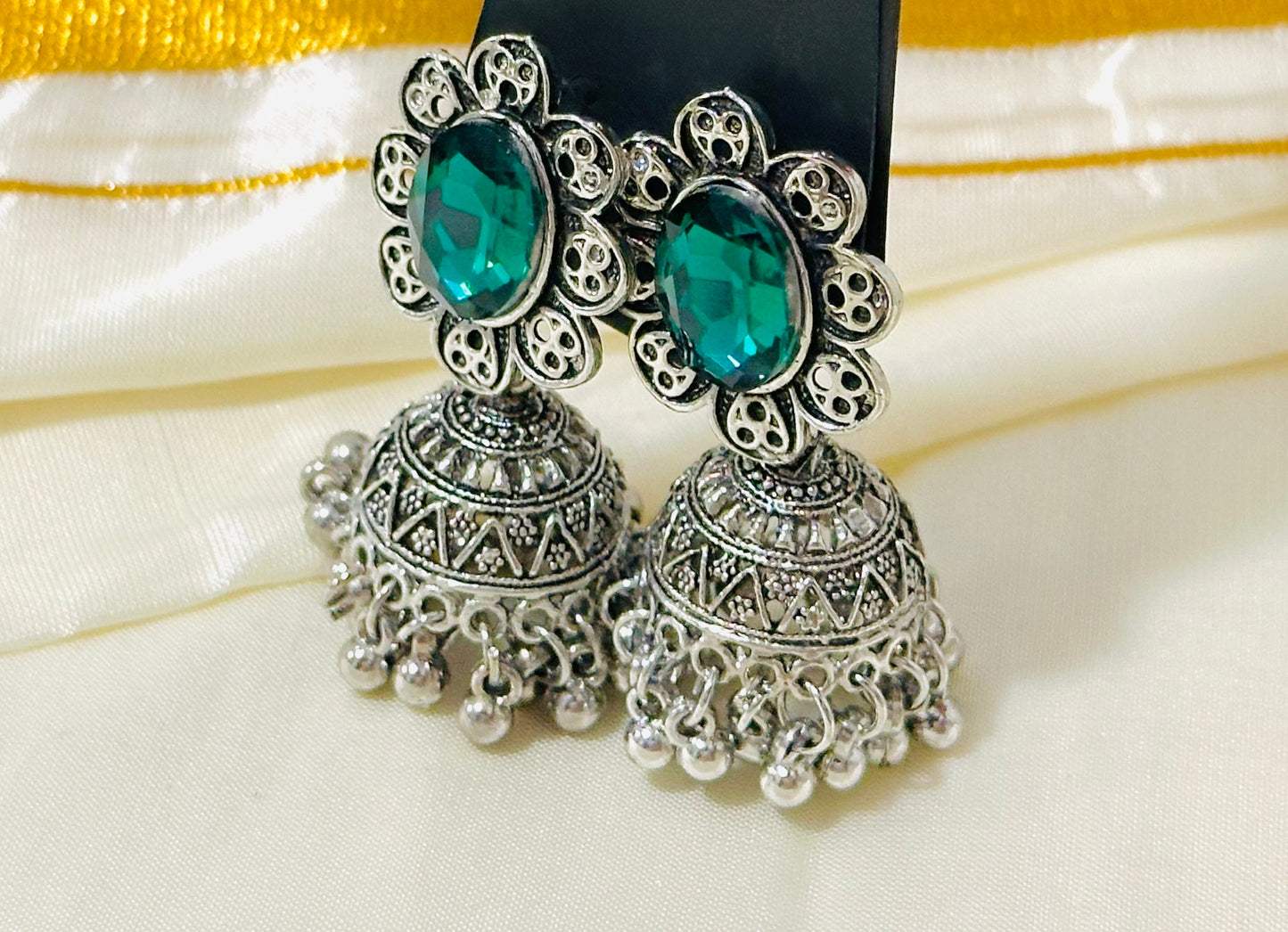 Enchanting Oxidized Silver Jhumka Earrings with color Stone