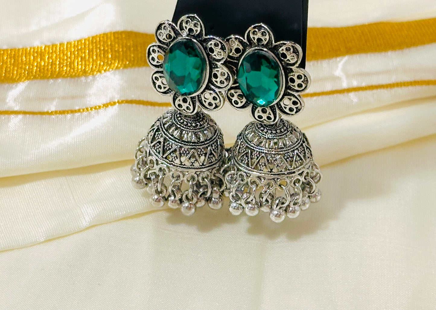 Enchanting Oxidized Silver Jhumka Earrings with color Stone
