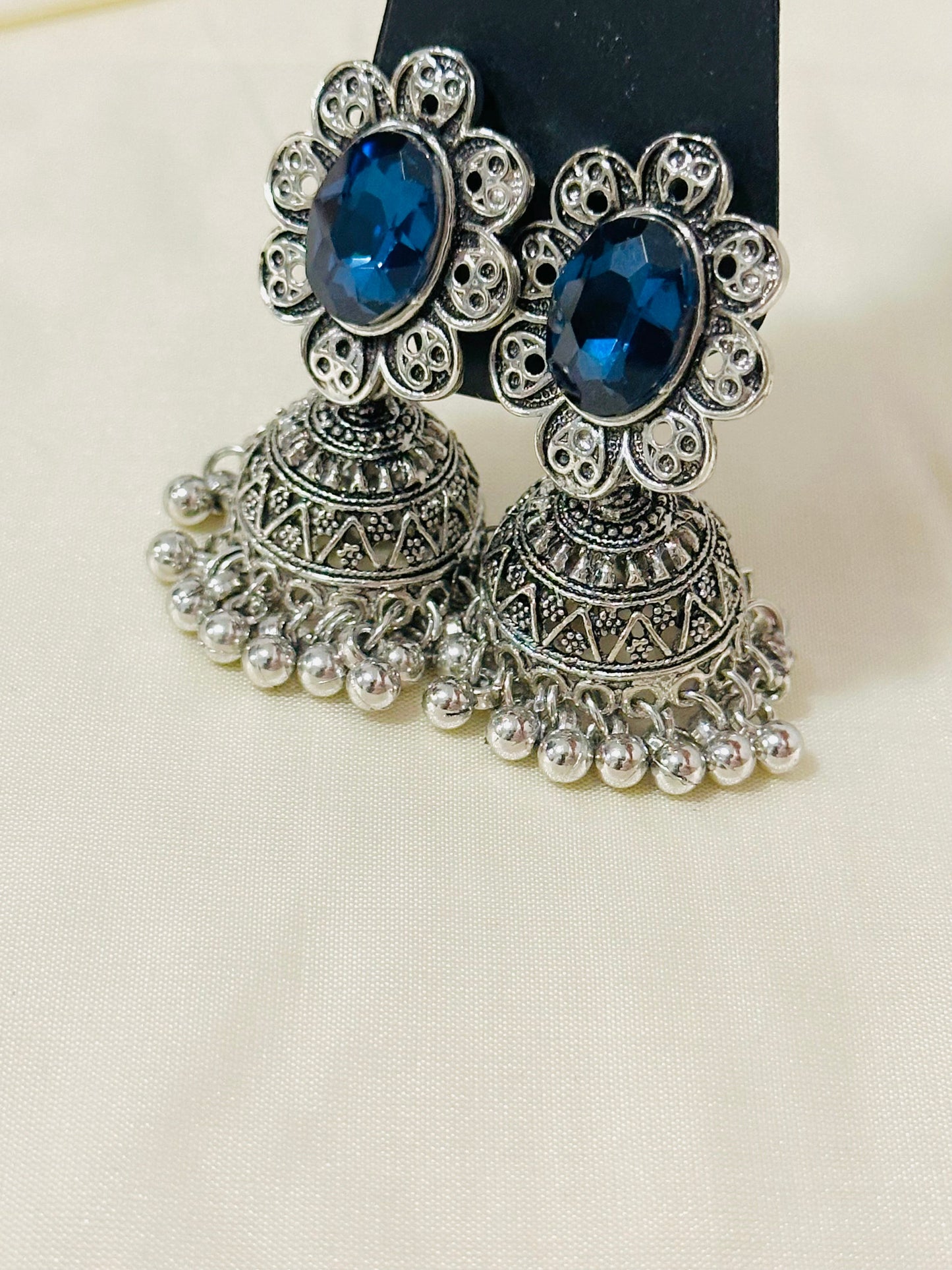 Enchanting Oxidized Silver Jhumka Earrings with color Stone