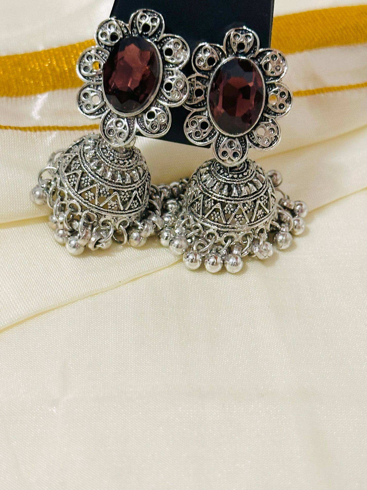 Enchanting Oxidized Silver Jhumka Earrings with color Stone