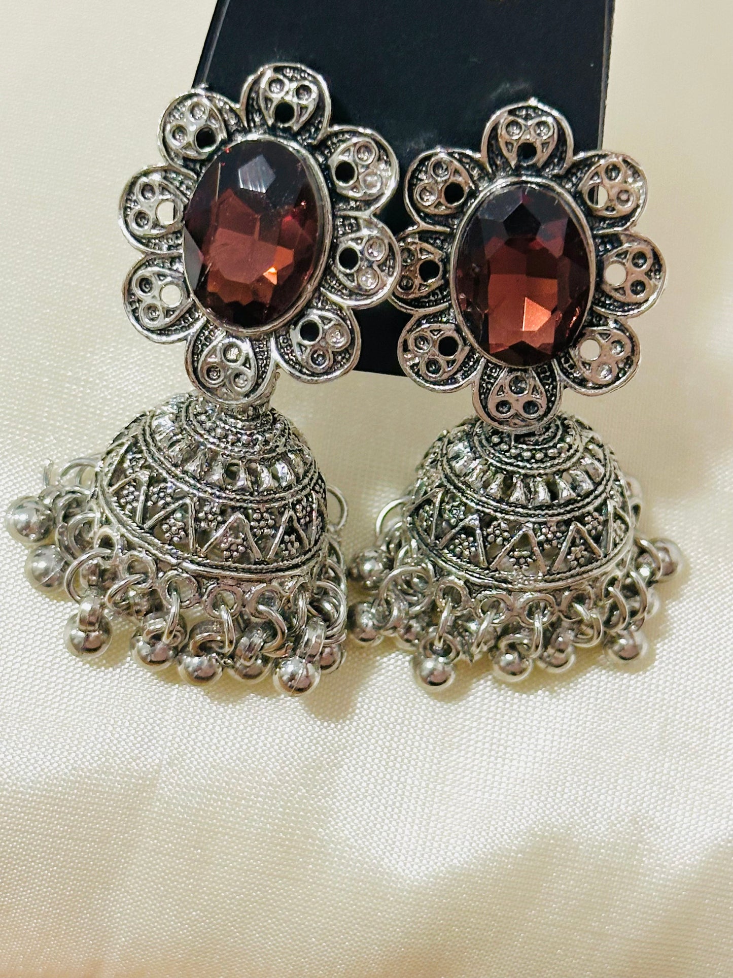 Enchanting Oxidized Silver Jhumka Earrings with color Stone