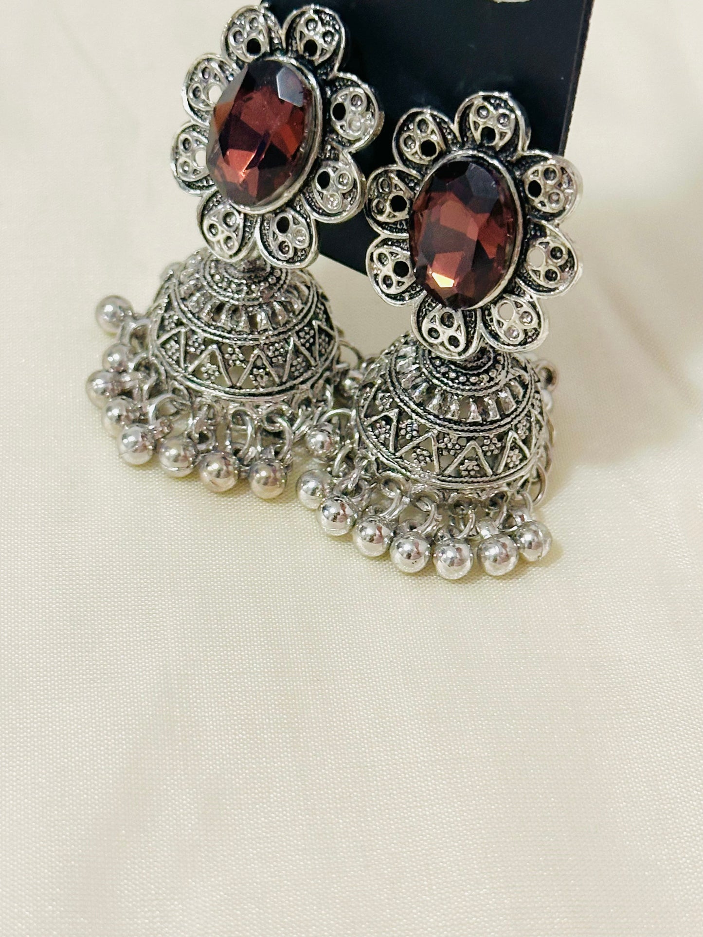 Enchanting Oxidized Silver Jhumka Earrings with color Stone