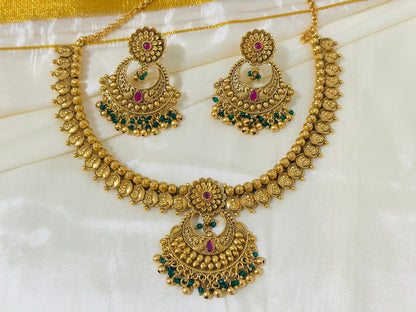 Exquisite Antique Gold-Toned Choker Necklace and Jhumka Earring Set with Floral and Crescent Motifs
