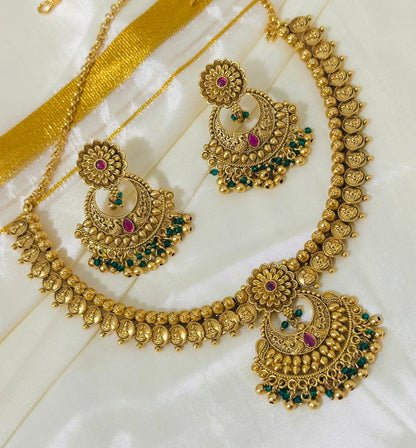 Exquisite Antique Gold-Toned Choker Necklace and Jhumka Earring Set with Floral and Crescent Motifs