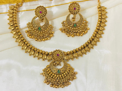 Exquisite Antique Gold-Toned Choker Necklace and Jhumka Earring Set with Floral and Crescent Motifs